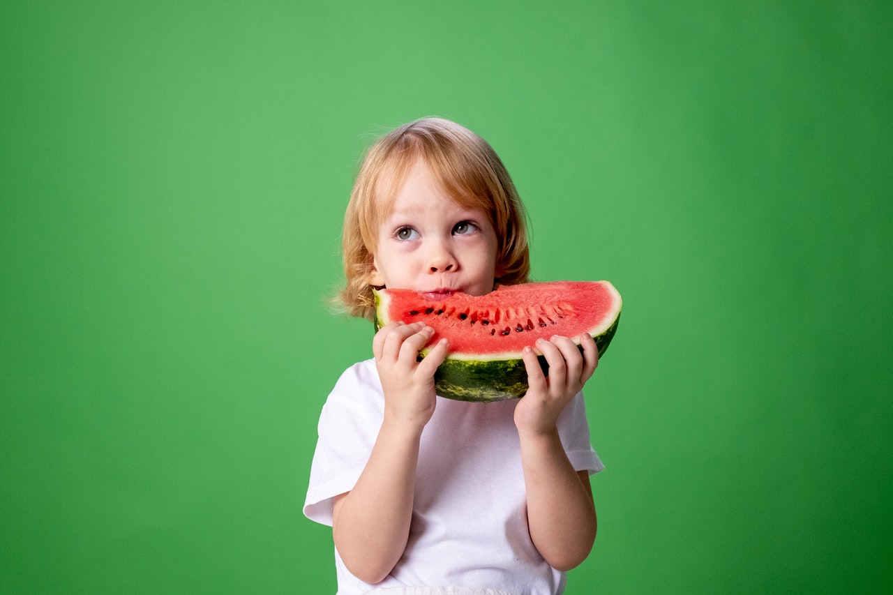Kid eating watermelon